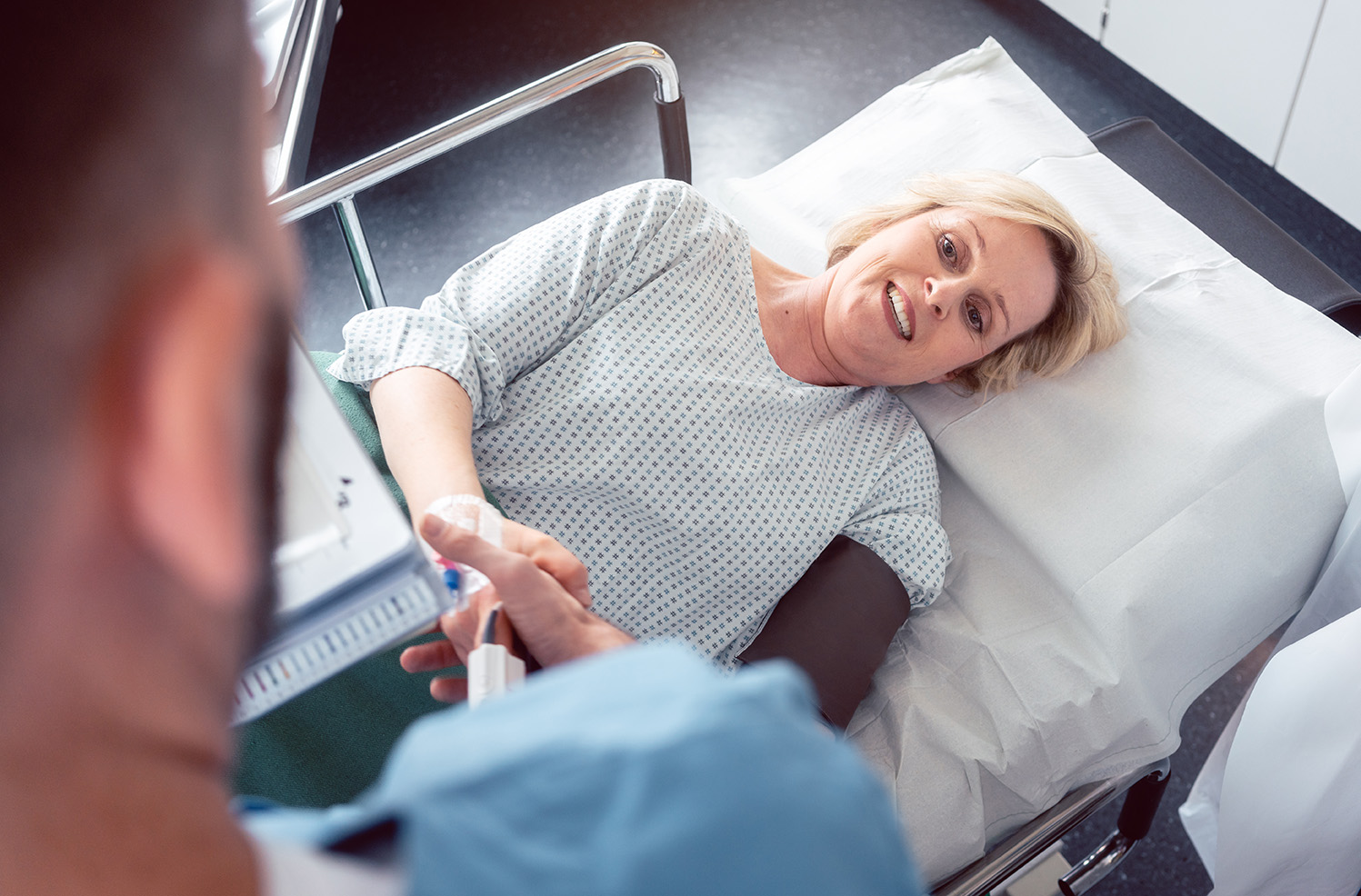 Doctor greeting patient before starting treatment
